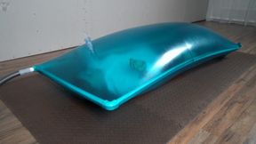 Blue inflatable latex vacuum bed for Sonya with a breathing dildo