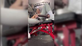 Blonde MILF plays with her pussy using a giant dildo at the gym