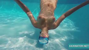 ”Hot Candy swims & strips nude underwater”