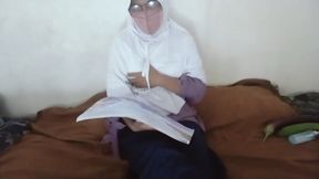 Aunty Riani looks at a picture of a nude person