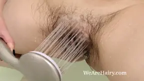 Brunette mature with big natural tits enjoys sexy bath masturbation