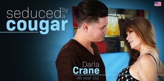 American MILF Darla Crane seduces a young man to fuck her wild at her house!