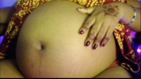 Pregnent lady playing big belly short.