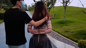 Bound Brunette's Oriental Outdoor Ordeal