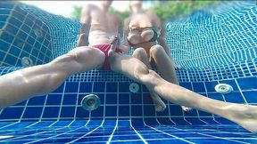 Gorgeous blonde makes her man cum right into the public pool after a quick handjob